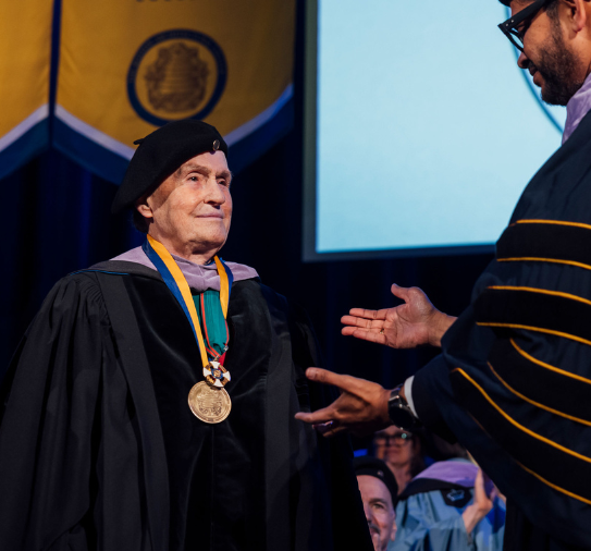 Franco Viticeillo, '68, stands for recognition at the BAC's 2025 Commencement Ceremony and to receive his honorary degree.