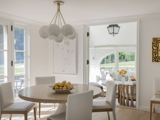 This Weston Home now holds a casual, everyday spot to dine sits adjacent to the kitchen in a calming, clean cream room designed by BAC Alum Nancy Hill, Certs'10. Photo courtesy of Boston Common.