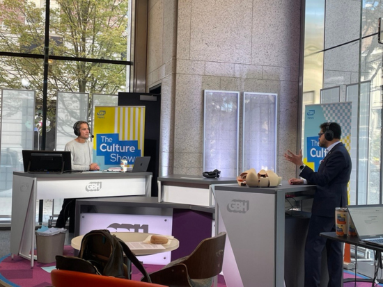 President Mahesh Daas records live with The Culture Show's host Jared Bowen at the GBH's Studio inside Boston Public Library.