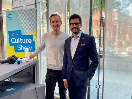 Jared Bowen and Mahesh Daas pose in between recording The Culture Show in the GBH Boston Public Library Studio.