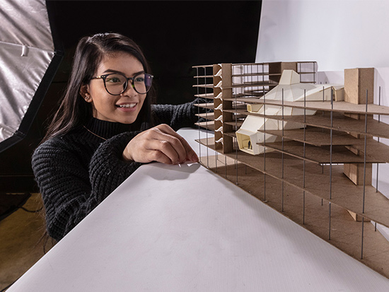 girl happy about her architecture model