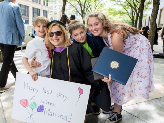 Two graduating students at the 2023 Commencement.