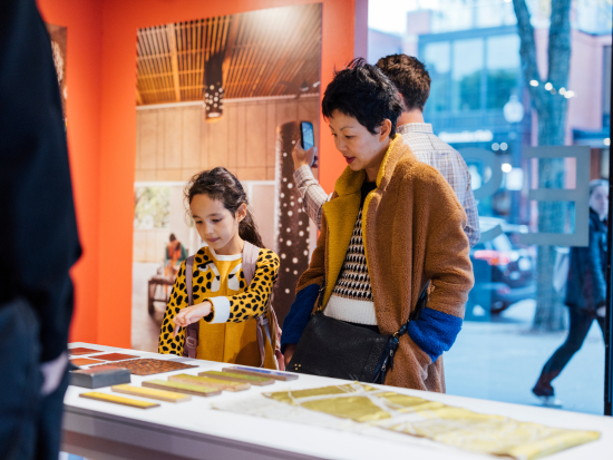 A woman and young child interact with the Slowness exhibit at the BAC McCormick Gallery.