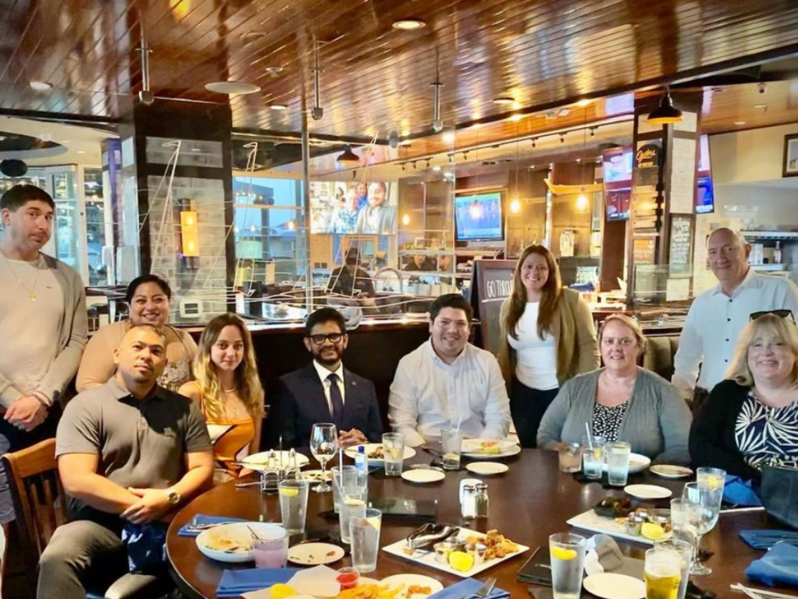 California Alumni Social Group Table Photo in Long Beach. July 2022.
