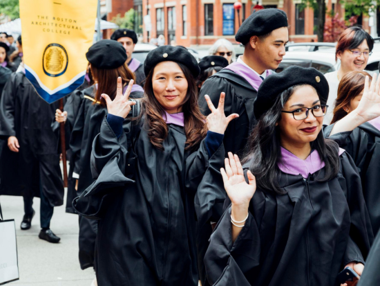 Students enjoy their processional to the auditorium for the 2022 BAC Commencement.