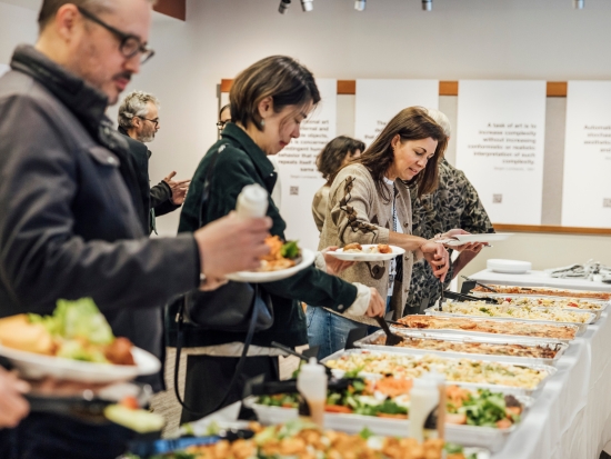 Guests serve themselves at a Community Lunch buffet.