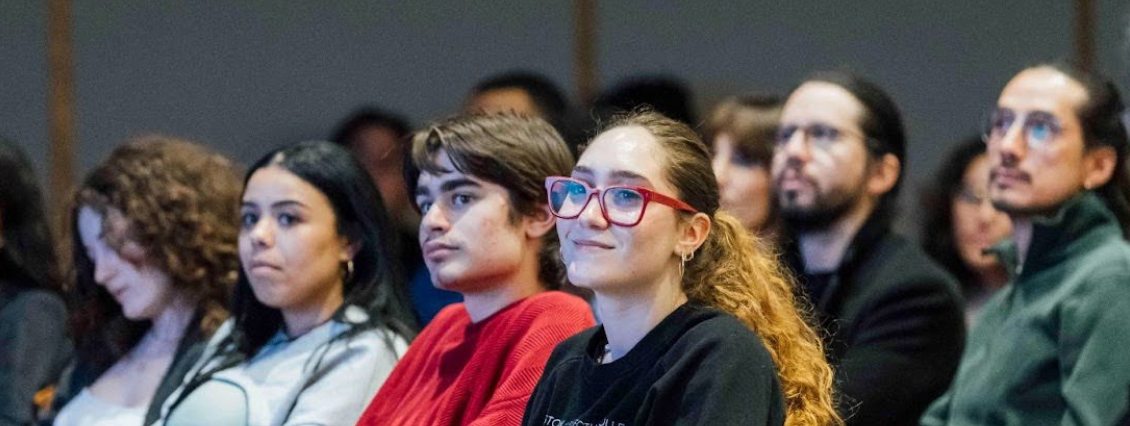 BAC community members listen intently to a speaker in Cascieri Hall.