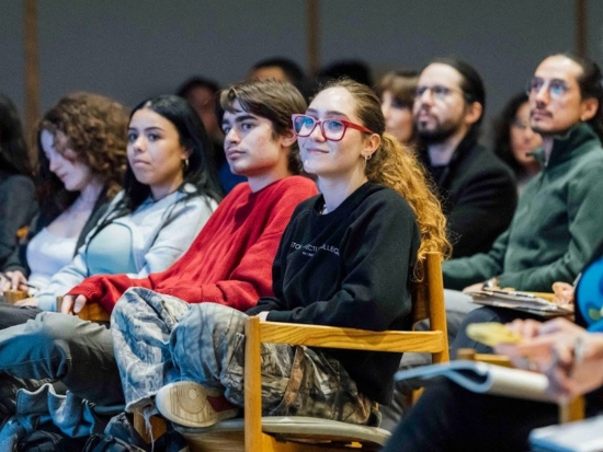 BAC community members listen intently to a speaker in Cascieri Hall.