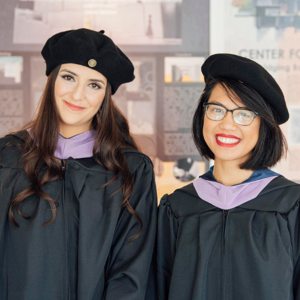 Two graduating students at the 2023 Commencement.