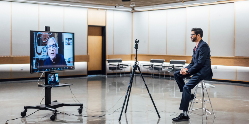 View of both President Daas and Professor Doshi speaking during the interview (conducted over a video call).