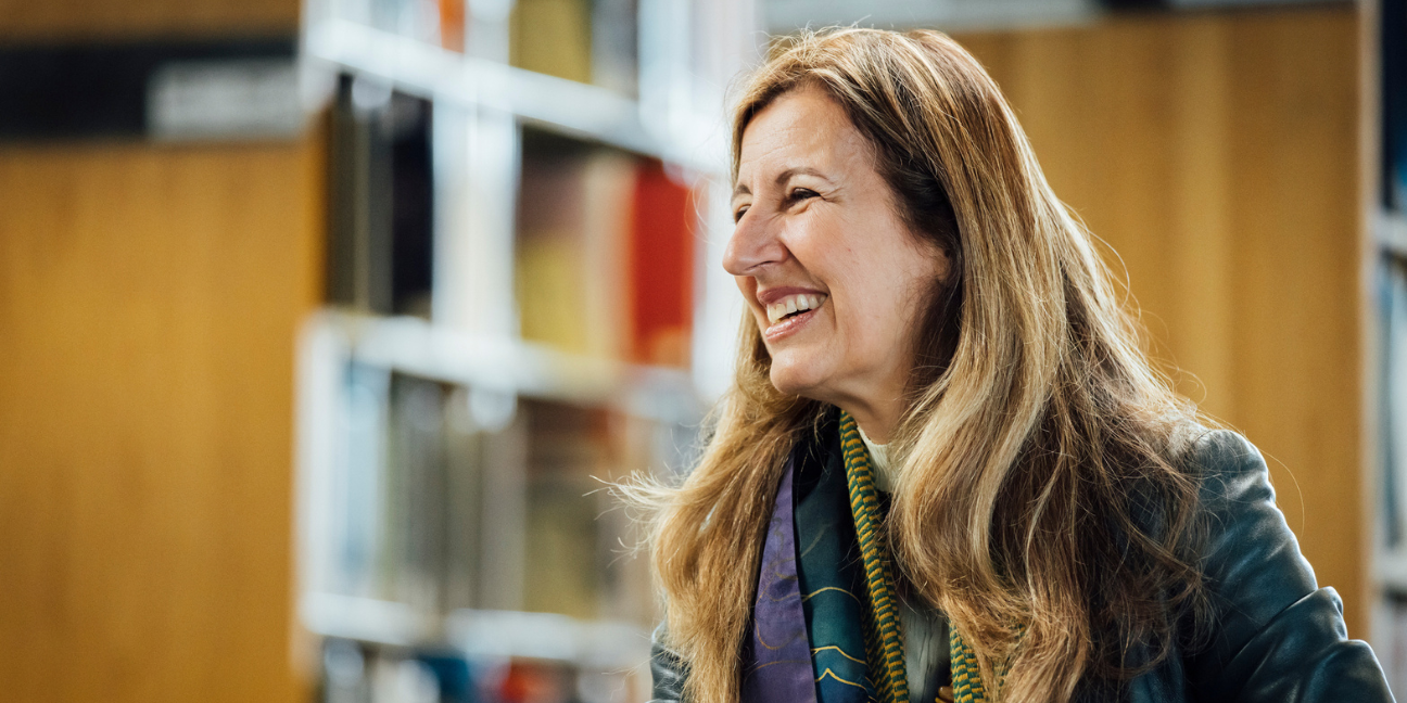 Benedetta Tagliabue speaks during a recorded conversation in the BAC library, gesturing while seated across from BAC President Mahesh Daas.