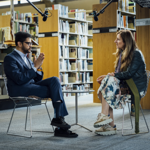 BAC President Mahesh Daas and Benedetta Tagliabue engage in a conversation in the BAC library, seated near shelves of design materials as recording equipment captures the exchange.