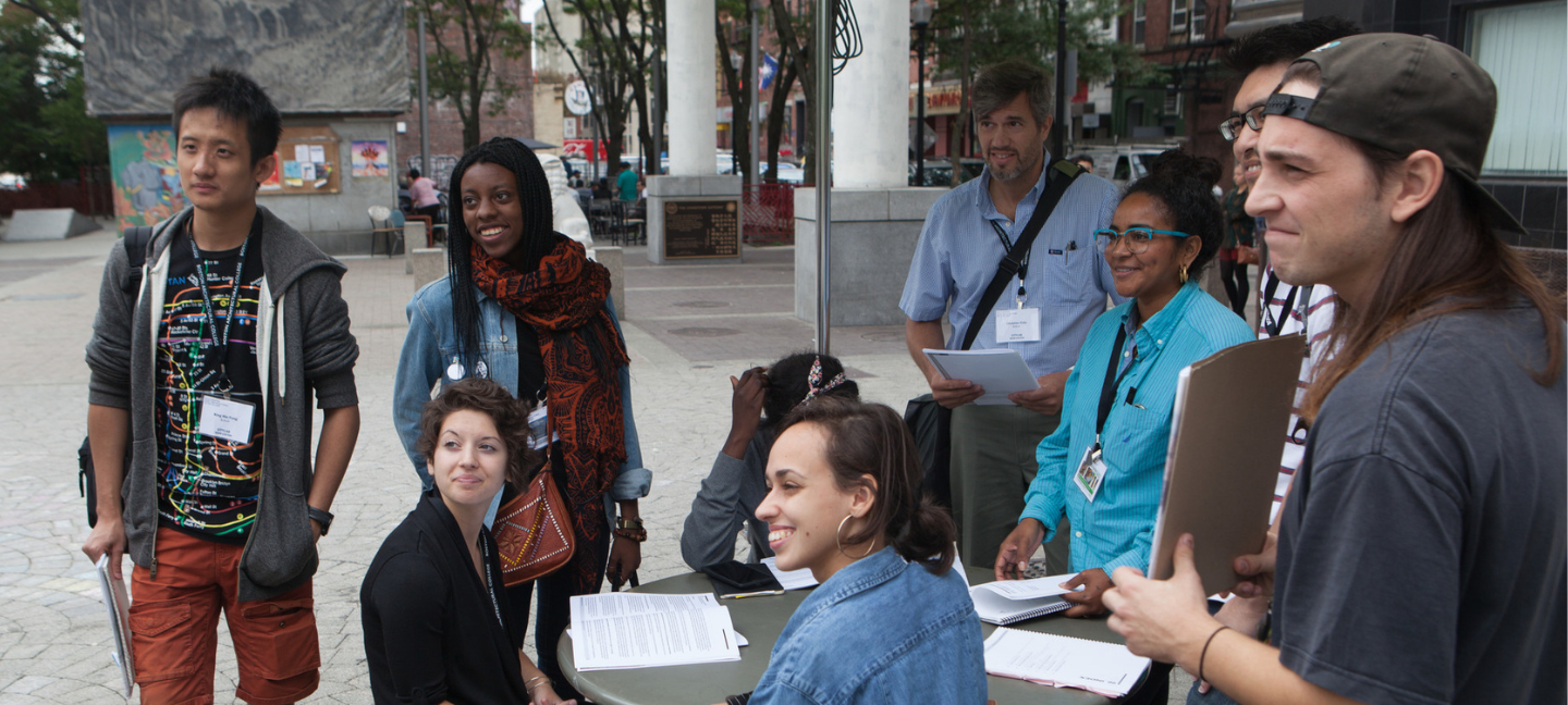 A group of students listened to an instructor during CityLab at Government Center and Chinatown in Boston.