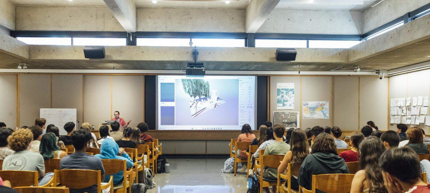 Summer Academy students listen to a lecture in Cascieri Hall.