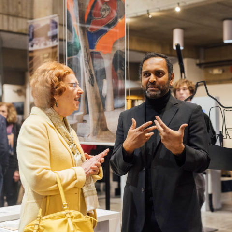 Marilyn Swartz-Lloyd, BAC Board of Trustees Vice President, and Kishore Varanasi, BAC Board of Trustees Member, interact in the McCormick Gallery at A Tribute to Balkrishna Doshi event.