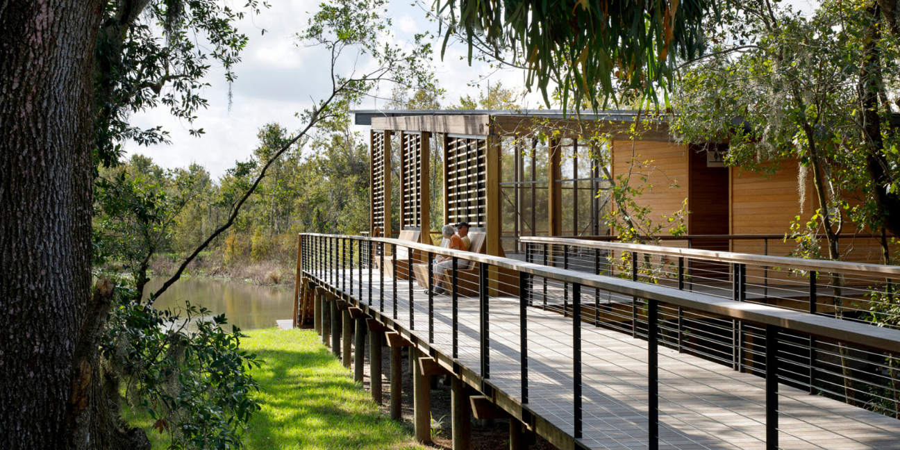 The nature center sits at the edge of the remdiated lagoon, tied into a system of boardwalks and framed by existing live oaks at Bonnet Springs Park - a remediated site invites visitors to explore the local Florida ecosystem by Sasaki.