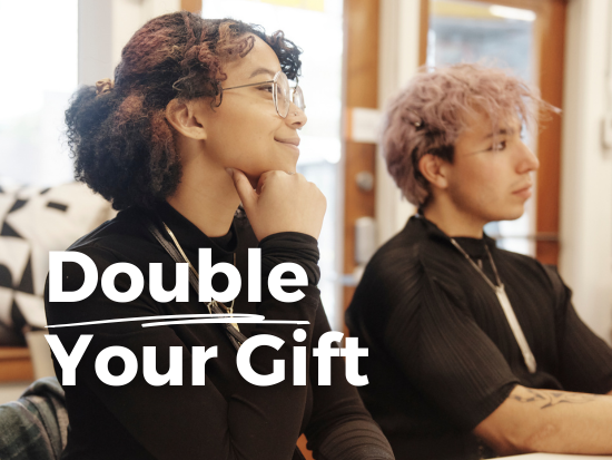 "Double Your Gift" (foreground) and students listening intently to a presentation (background).