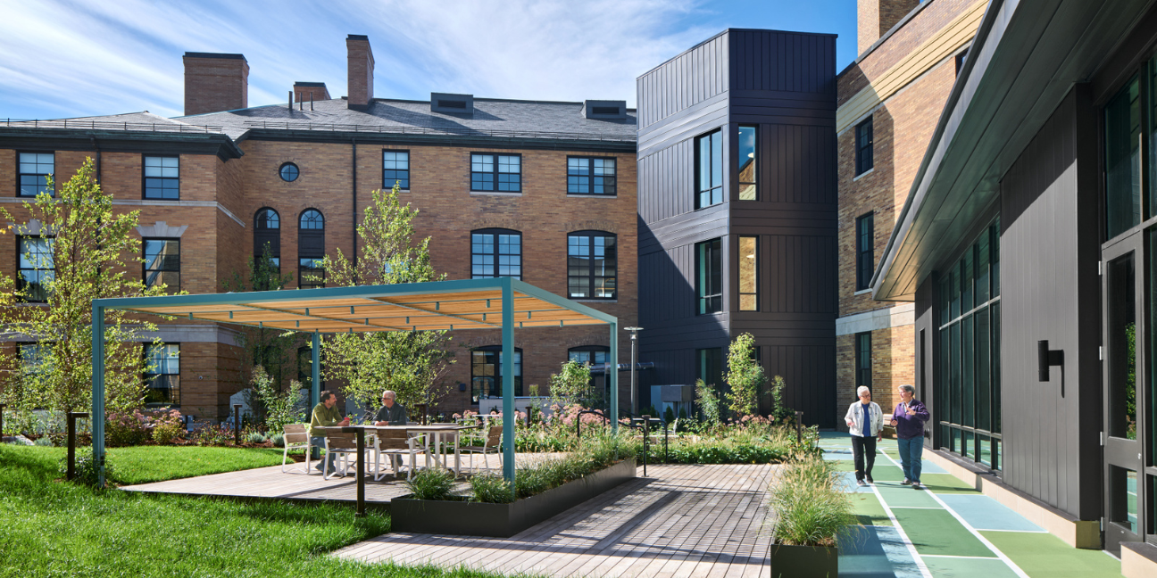 View of The Pryde's landscaped courtyard will include raised beds, a walking track, and outdoor seating below a pergola for social gathering. Courtesy of DiMella Shaffer.