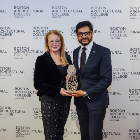 Janet Roche, MDS-DHH'17, accepts a Distinguished Alumni in Practice Award from President Mahesh Daas at the 2026 Alumni and Friends Awards' Ceremony.