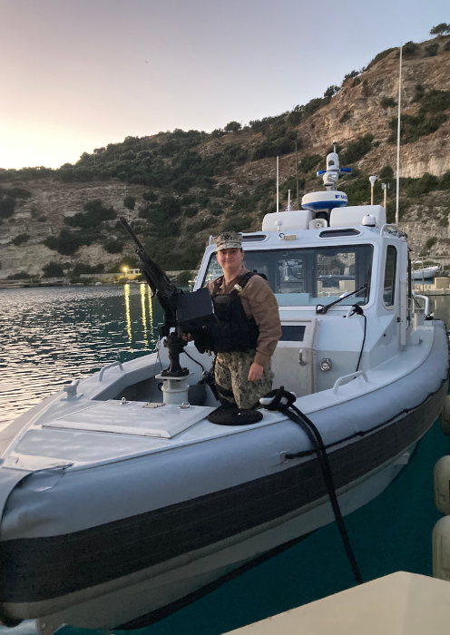 Catherine Hale on a boat while serving as a Master of Arms for the U.S. Navy, stationed on the island of Crete in Greece.