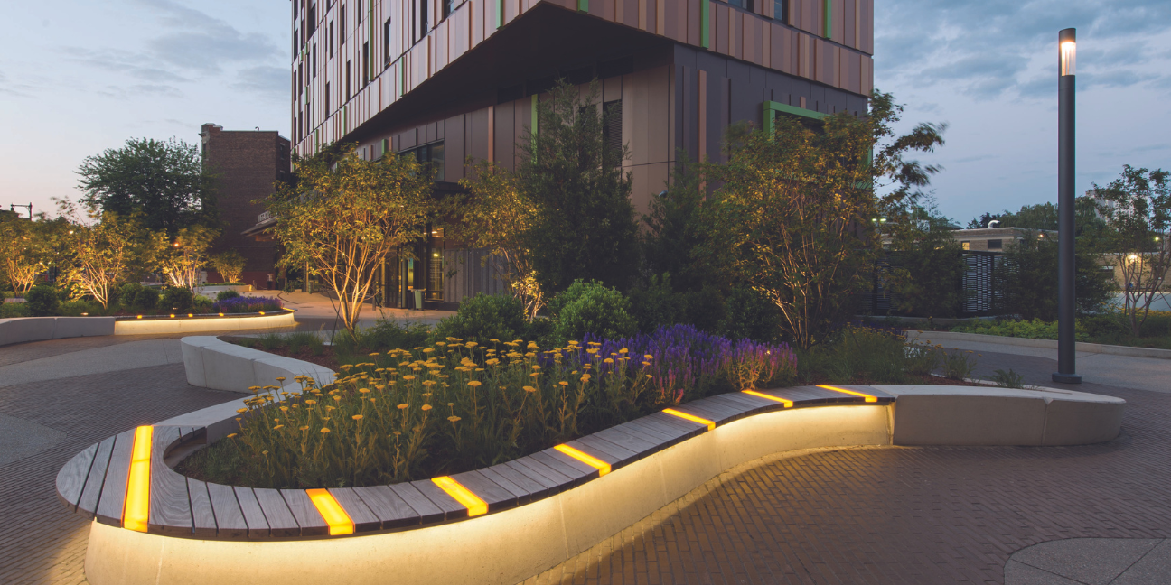 Outside landscaped planters with surround bench seating at the MassArt Tree House Residence Hall. Courtesy of Ground, Inc. Photograph by Chuck Choi.
