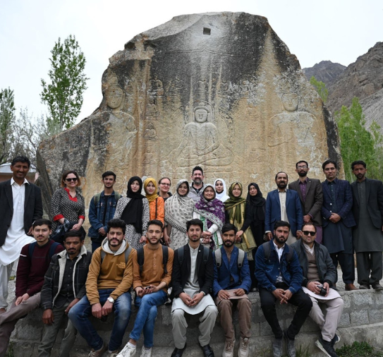 Students in the new UoBS Archaeology and Heritage Studies program with UoBS faculty and BAC partners at Buddha Rock, Skardu. Photo by David Hansen.