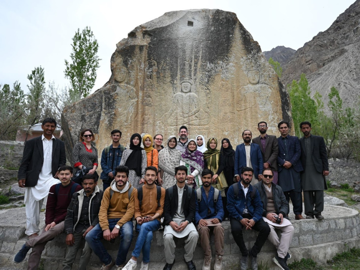 Students in the new UOBS Archaeology and Heritage Studies program with UOBS faculty and BAC partners at Buddha Rock, Skardu. Photo by David Hansen.