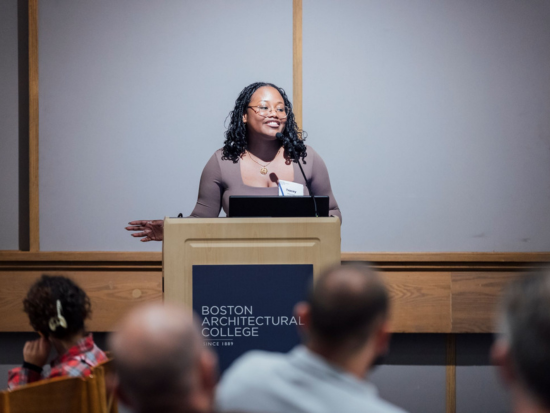 Tracy Previlon, B.Arch student, speaking at a podium.