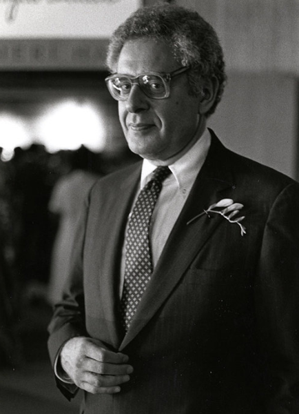 President Bernard Spring standing in front of Cascieri Lecture Hall. Courtesy of the BAC Archives.