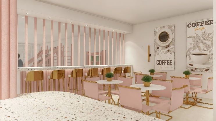 Soft pink caf&eacute; interior with gold-accented chairs, round white tables, and a bar lined with high stools. Decorative wall art reading &lsquo;Coffee&rsquo; hangs above the seating, and a children&rsquo;s play area is visible behind a partition. Project Designer: Rai Ramirez-Barbosa, Flow Design Architects.