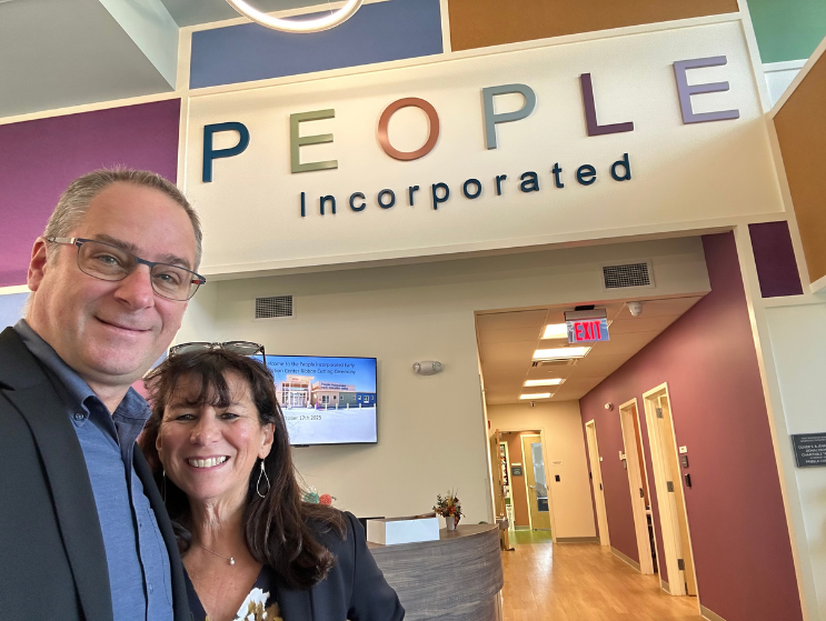 Felice and David Silverman stand in the lobby of People's Incorporated.